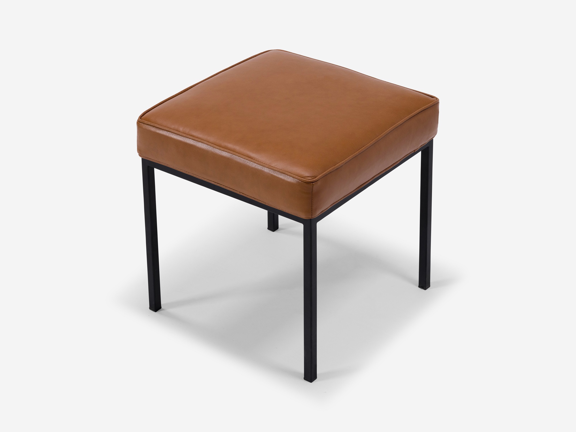 Detail view of the Bank fabric stool with dark brown leather seat and black base